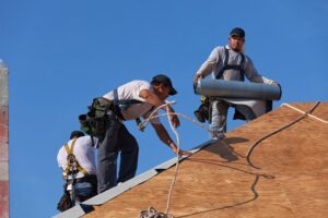 Workers setting up a Commercial Steep Slope Roofing in Memphis, TN