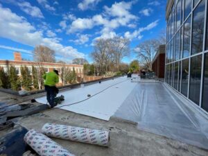 Workers fixing a roof in a Commercial Roofing project in Memphis, TN